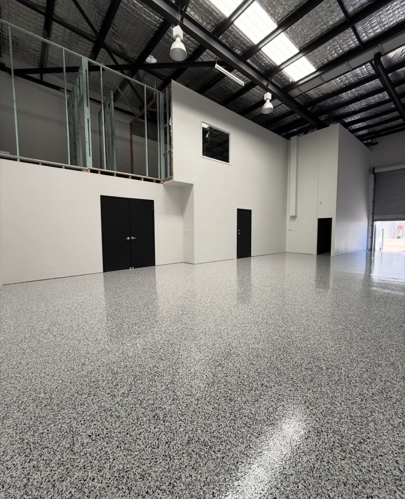 Commercial warehouse with a light grey epoxy flake floor